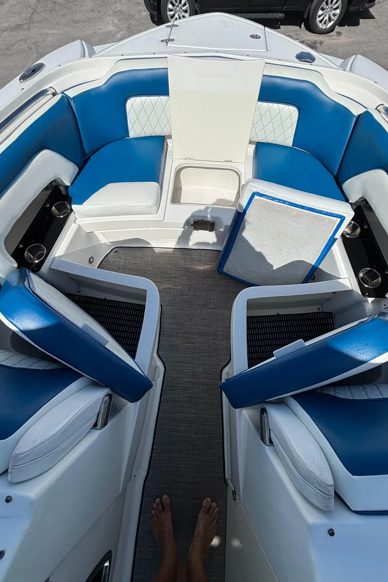 Slide: The Image of Interior of a 2017 Monterey M65 boat with blue and white seating. - 4