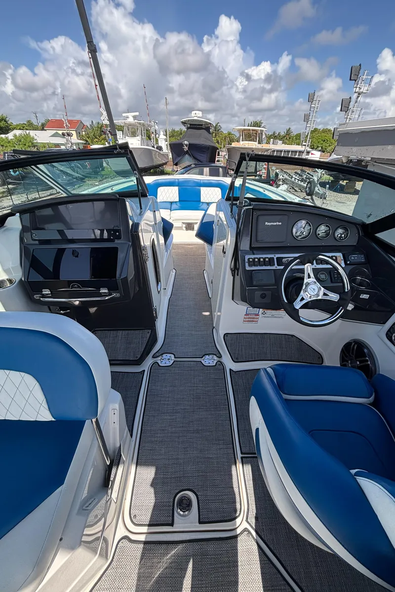 Slide: The Image of Interior of a 2017 Monterey M65 boat with blue and white seating. - 6