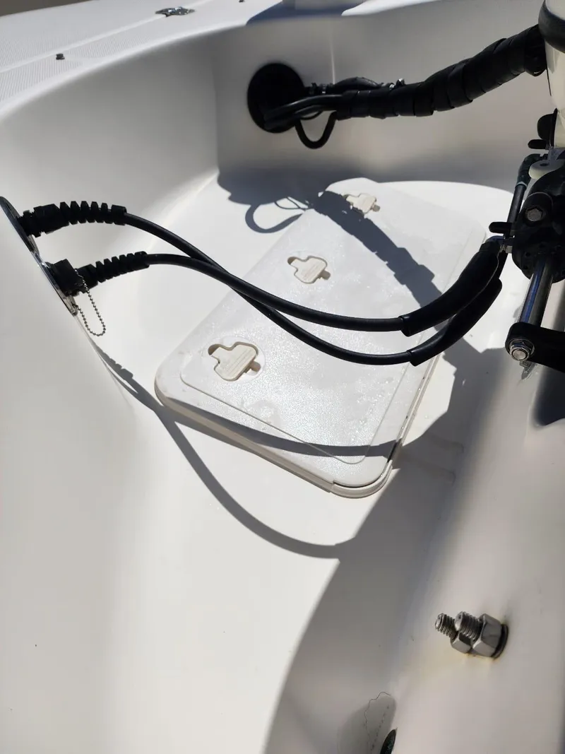Slide: The Image of Bilge area of a 2017 Bulls Bay 230 Center Console boat with hoses and wiring. - 12