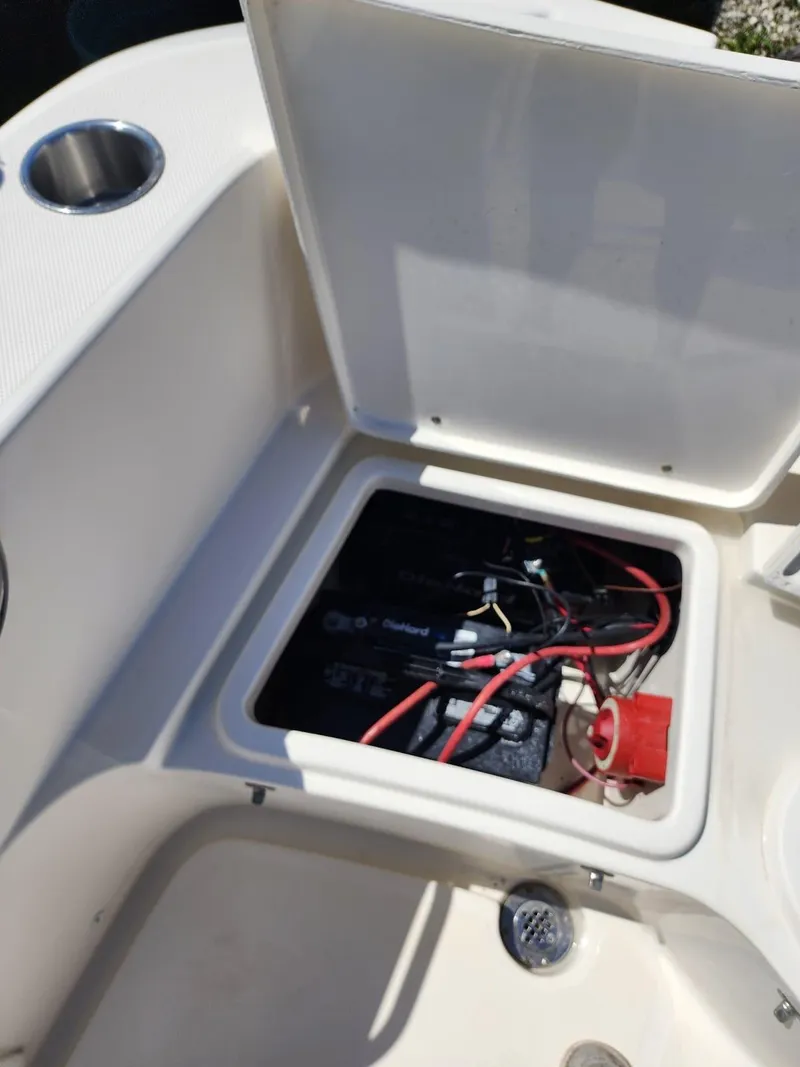 Slide: The Image of Battery compartment of a 2017 Bulls Bay 230 Center Console boat with DieHard batteries. - 15