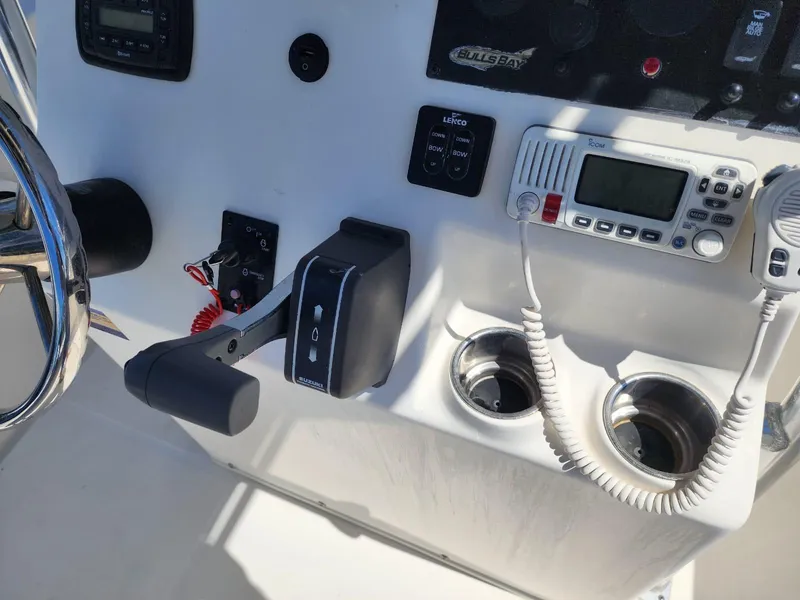 Slide: The Image of 2017 Bulls Bay 230 Center Console boat with T-top, clear sky background. - 18