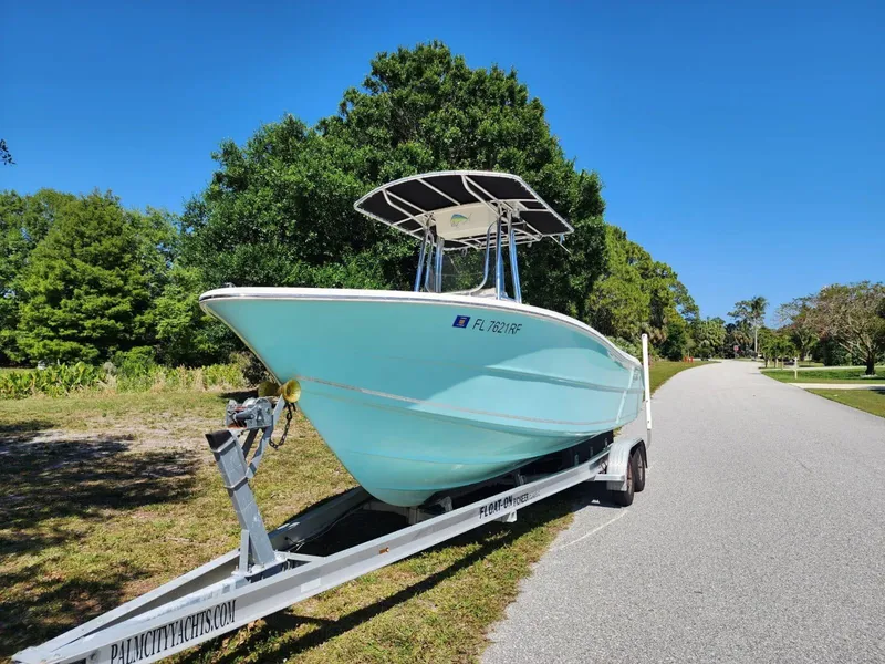 Slide: The Image of 2017 Bulls Bay 230 Center Console boat on trailer with Suzuki outboard motor. - 2