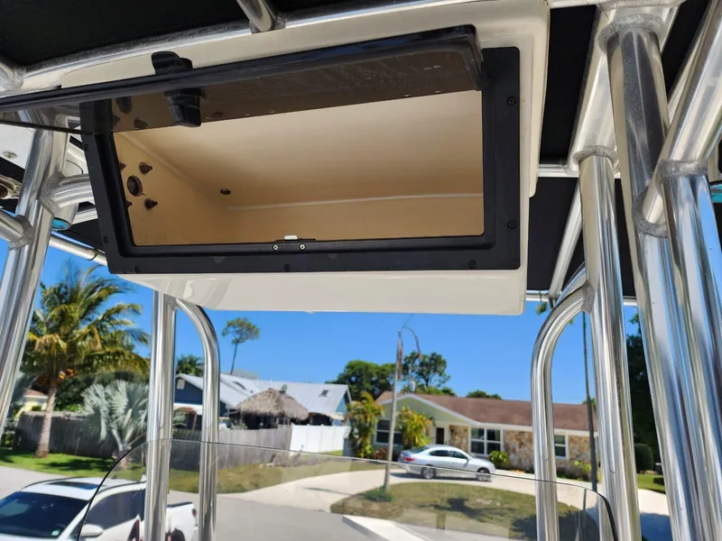 Slide: The Image of 2017 Bulls Bay 230 Center Console boat dashboard with steering wheel and navigation instruments. - 21