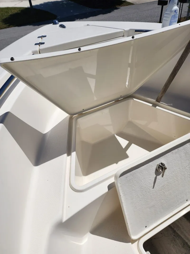 Slide: The Image of 2017 Bulls Bay 230 Center Console boat interior with speaker and railing detail. - 25