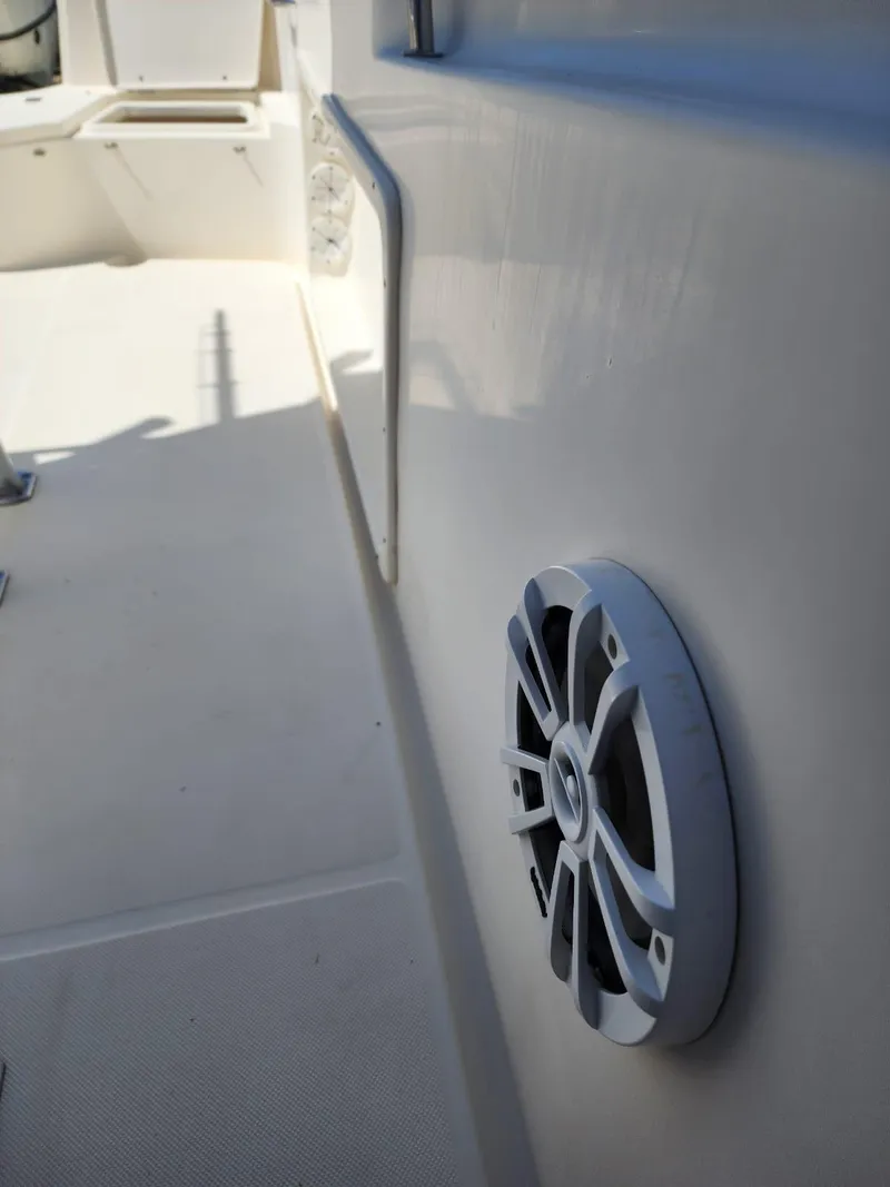 Slide: The Image of Open storage compartment on a 2017 Bulls Bay 230 Center Console boat. - 34