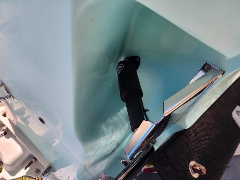 Slide: The Image of 2017 Bulls Bay 230 Center Console boat on trailer, parked on a sunny road. - 4