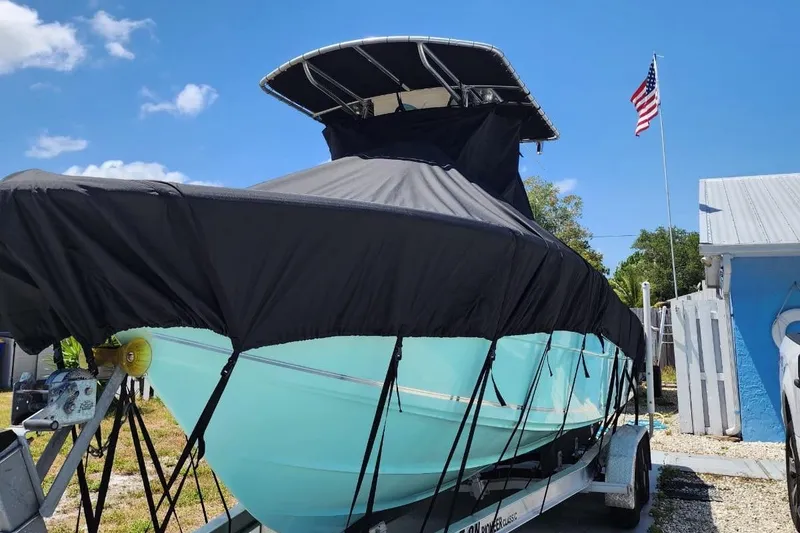 Slide: The Image of 2017 Bulls Bay 230 Center Console boat with T-top under clear blue sky. - 43