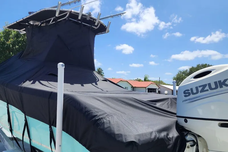 Slide: The Image of 2017 Bulls Bay 230 Center Console boat, rear view with outboard motor, parked outdoors. - 44