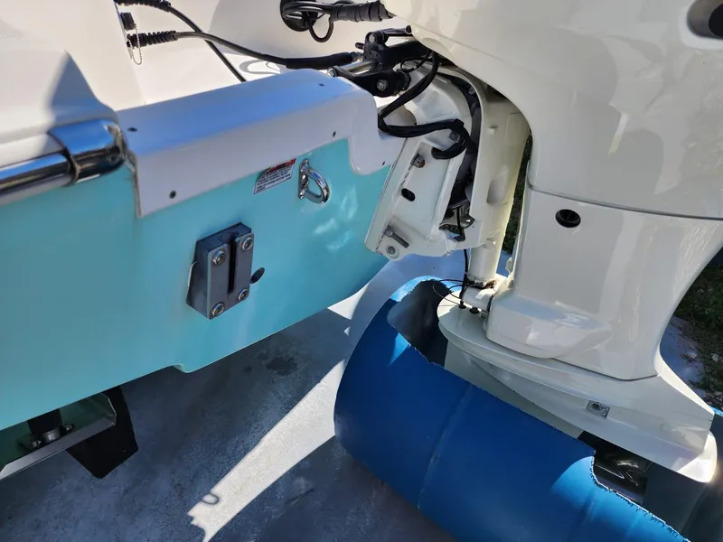 Slide: The Image of 2017 Bulls Bay 230 Center Console boat on trailer, showing trim tab and hull detail. - 5