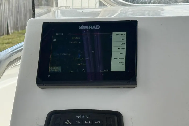 Slide: The Image of 2017 Bulls Bay 230 Center Console dashboard with gauges and controls. - 53