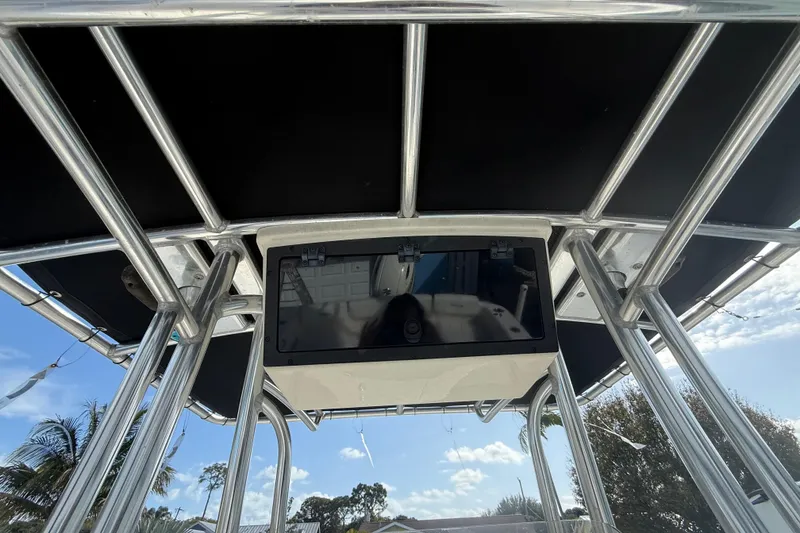 Slide: The Image of 2017 Bulls Bay 230 Center Console boat with Suzuki 200 engine, parked outdoors. - 55