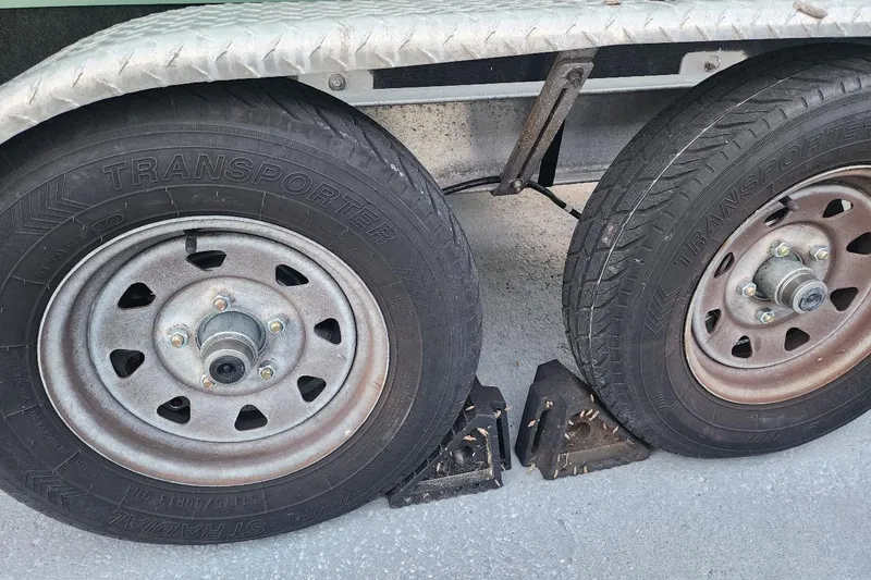 Slide: The Image of Trailer wheels with chocks for a 2017 Bulls Bay 230 Center Console boat. - 62