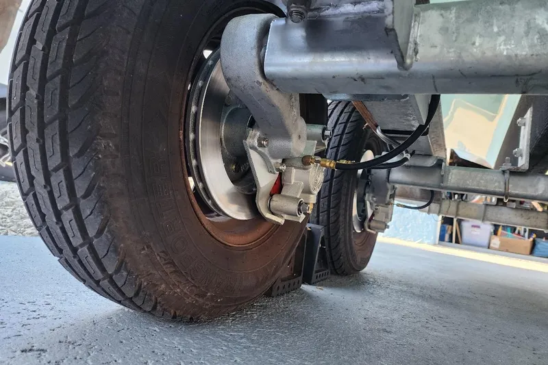 Slide: The Image of Close-up of 2017 Bulls Bay 230 Center Console trailer wheels and brake system. - 65