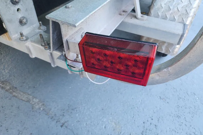 Slide: The Image of Red trailer light on a 2017 Bulls Bay 230 Center Console boat trailer. - 66