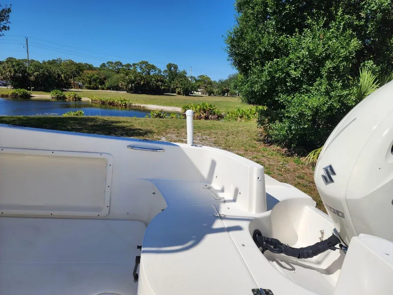 Slide: The Image of 2017 Bulls Bay 230 Center Console boat's livewell and storage compartments. - 8