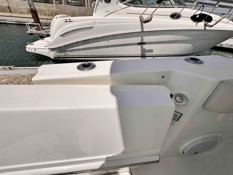 Slide: The Image of 2018 Boston Whaler 350 Outrage docked beside another boat in a marina. - 19