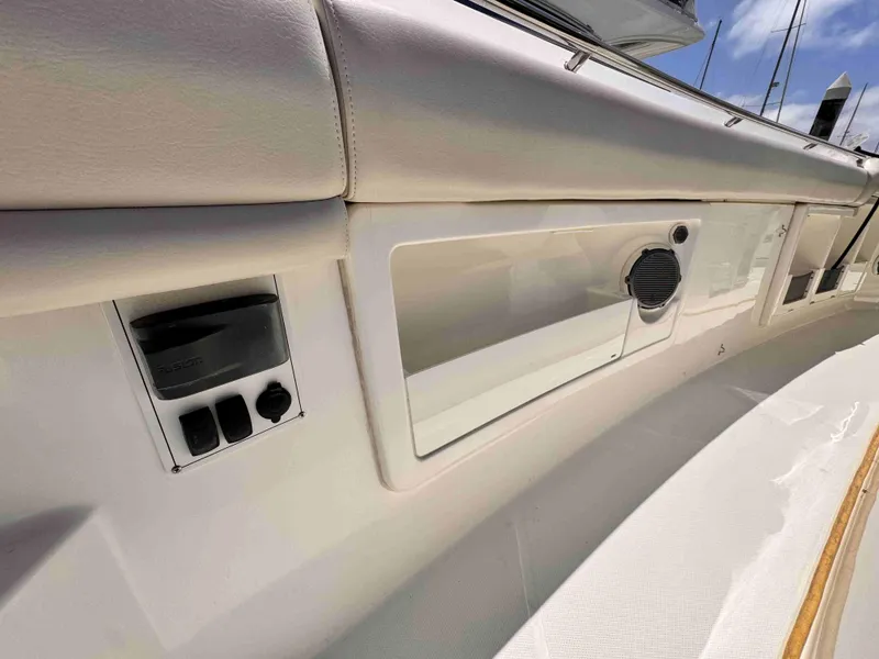 Slide: The Image of Interior view of 2018 Boston Whaler 350 Outrage boat, featuring seating and control panel. - 25