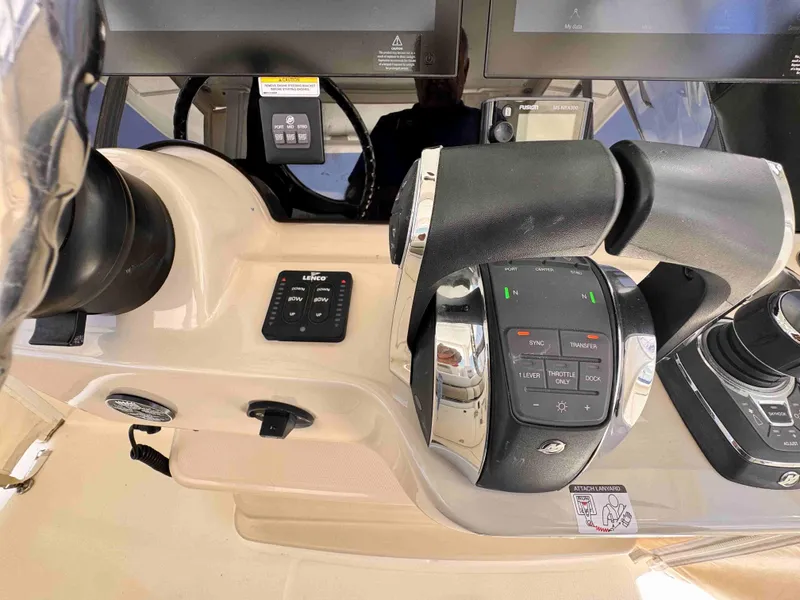 Slide: The Image of 2018 Boston Whaler 350 Outrage helm controls with advanced navigation system. - 31