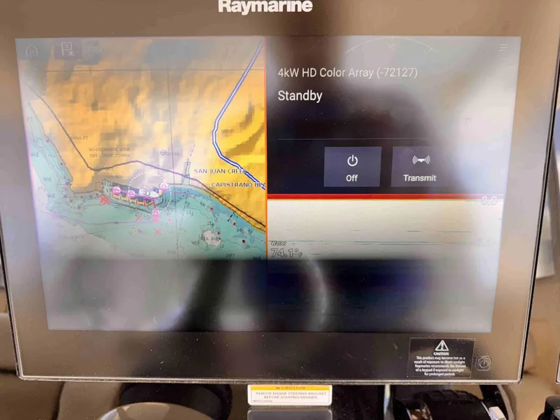 Slide: The Image of Raymarine navigation display on 2018 Boston Whaler 350 Outrage, showing map and radar settings. - 35