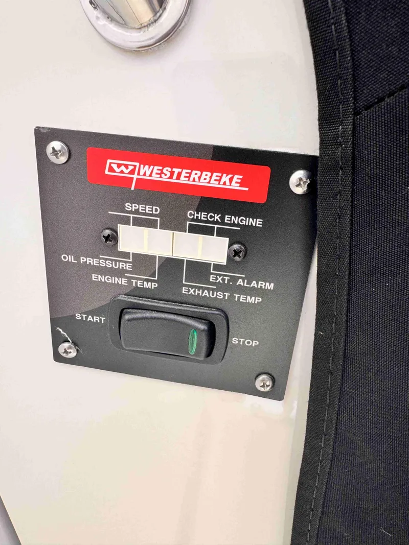 Slide: The Image of Control panel of a 2018 Boston Whaler 350 Outrage with Westerbeke engine indicators. - 36