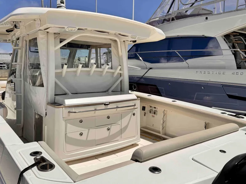 Slide: The Image of 2018 Boston Whaler 350 Outrage boat, featuring spacious deck and modern amenities. - 5