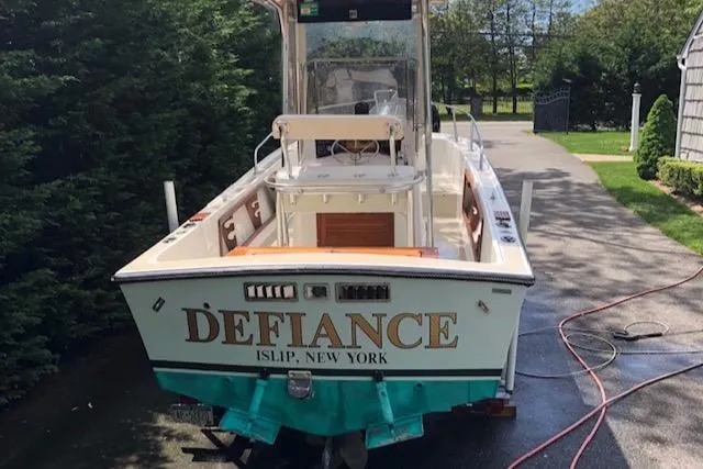 Slide: The Image of 1982 Mako 23 Inboard Diesel boat named "Defiance" in driveway, Islip, New York. - 11
