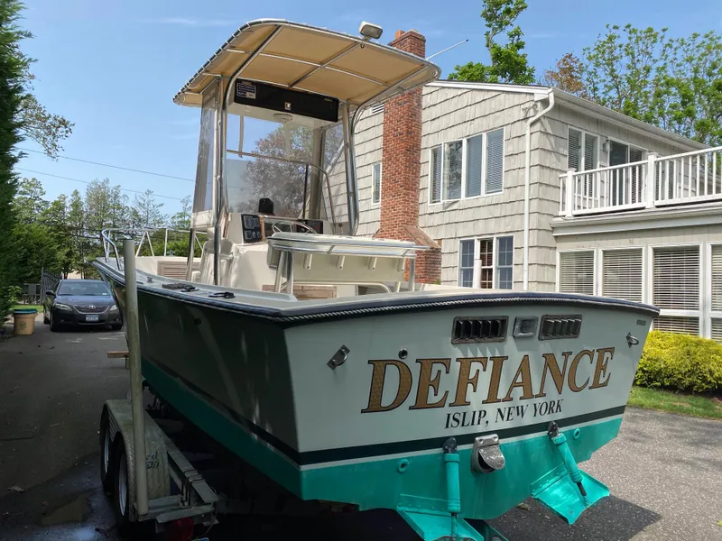 Slide: The Image of 1982 Mako 23 Inboard Diesel boat named "Defiance" on trailer, Islip, New York. - 12