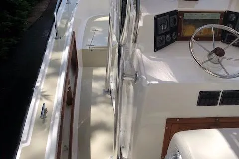 Slide: The Image of 1982 Mako 23 Inboard Diesel boat interior with steering wheel and control panel. - 16