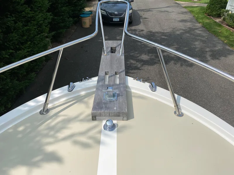Slide: The Image of Bow view of 1982 Mako 23 Inboard Diesel boat with stainless steel railings. - 22