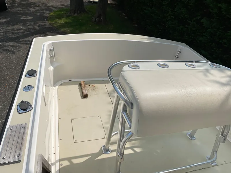 Slide: The Image of 1982 Mako 23 Inboard Diesel boat interior with seating and deck details. - 28