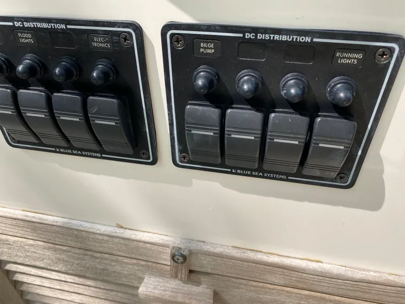 Slide: The Image of Control panel on a 1982 Mako 23 Inboard Diesel boat, featuring DC distribution switches. - 30