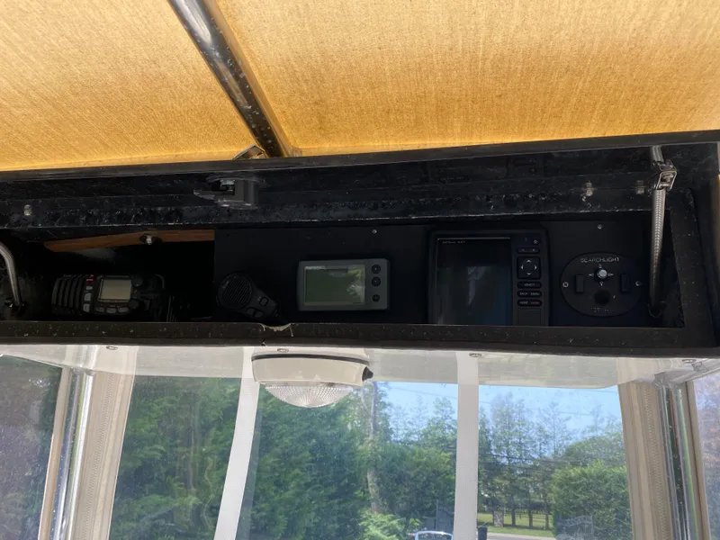 Slide: The Image of Control panel of a 1982 Mako 23 Inboard Diesel boat with navigation equipment. - 33