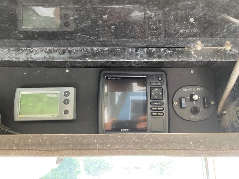 Slide: The Image of Control panel of a 1982 Mako 23 Inboard Diesel boat with navigation equipment. - 34