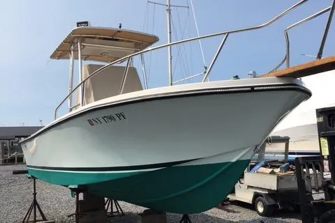 Slide: The Image of 1982 Mako 23 Inboard Diesel boat on display, featuring a sleek design and sturdy build. - 4