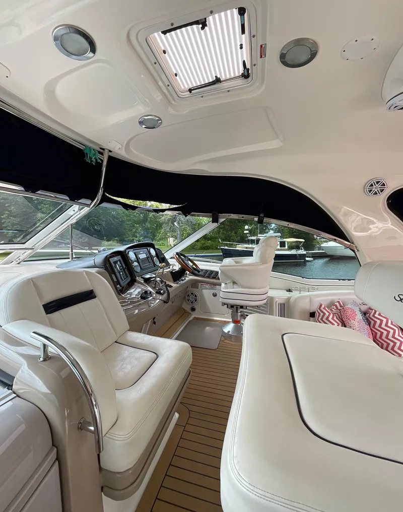 Slide: The Image of Luxurious interior of a 2005 Sea Ray 500 Sundancer yacht with plush seating. - 12