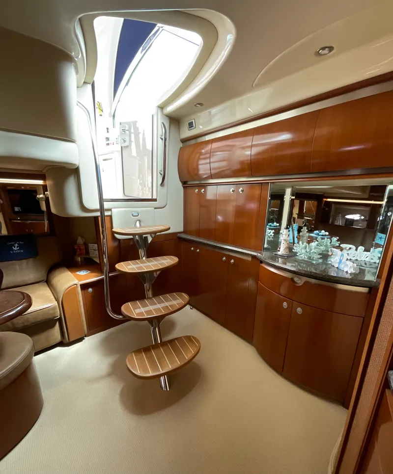 Slide: The Image of Luxurious interior of 2005 Sea Ray 500 Sundancer yacht with elegant wooden cabinetry. - 15