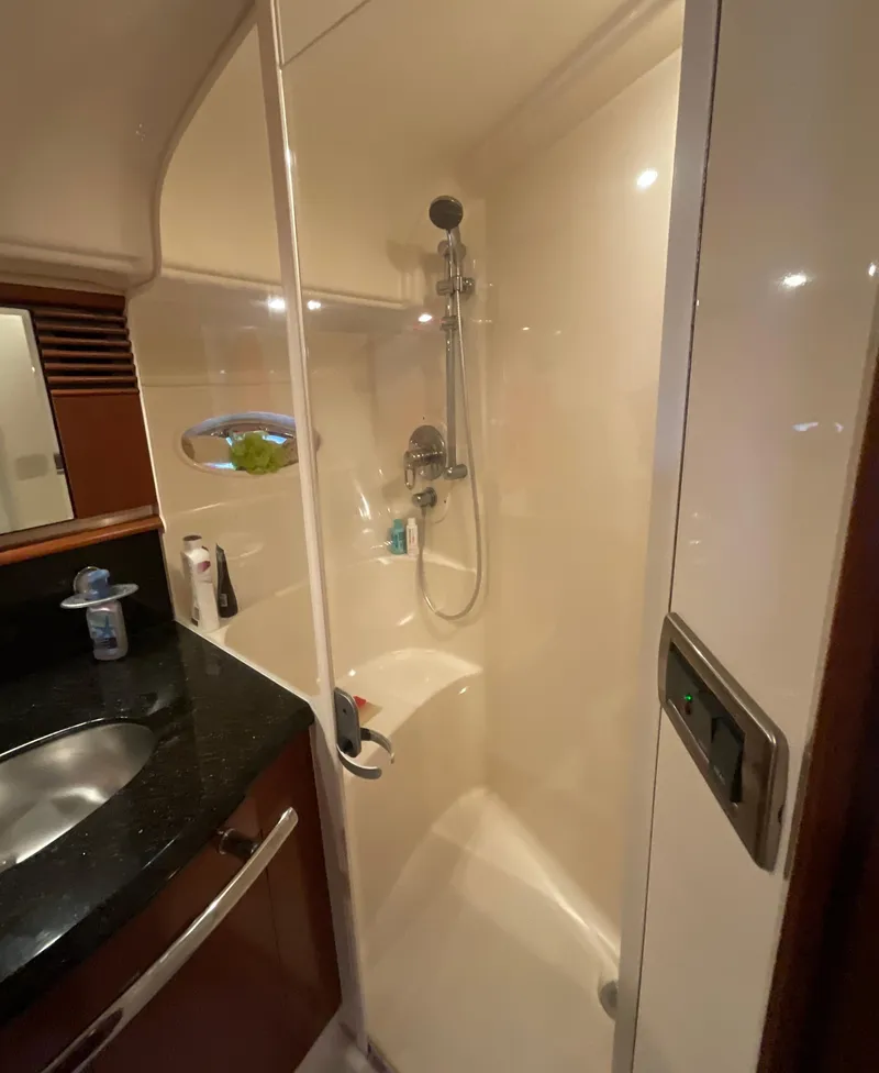 Slide: The Image of Luxurious bathroom in 2005 Sea Ray 500 Sundancer yacht with shower and sink. - 24