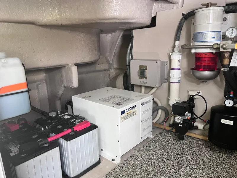 Slide: The Image of Engine room of 2005 Sea Ray 500 Sundancer with batteries and equipment. - 39