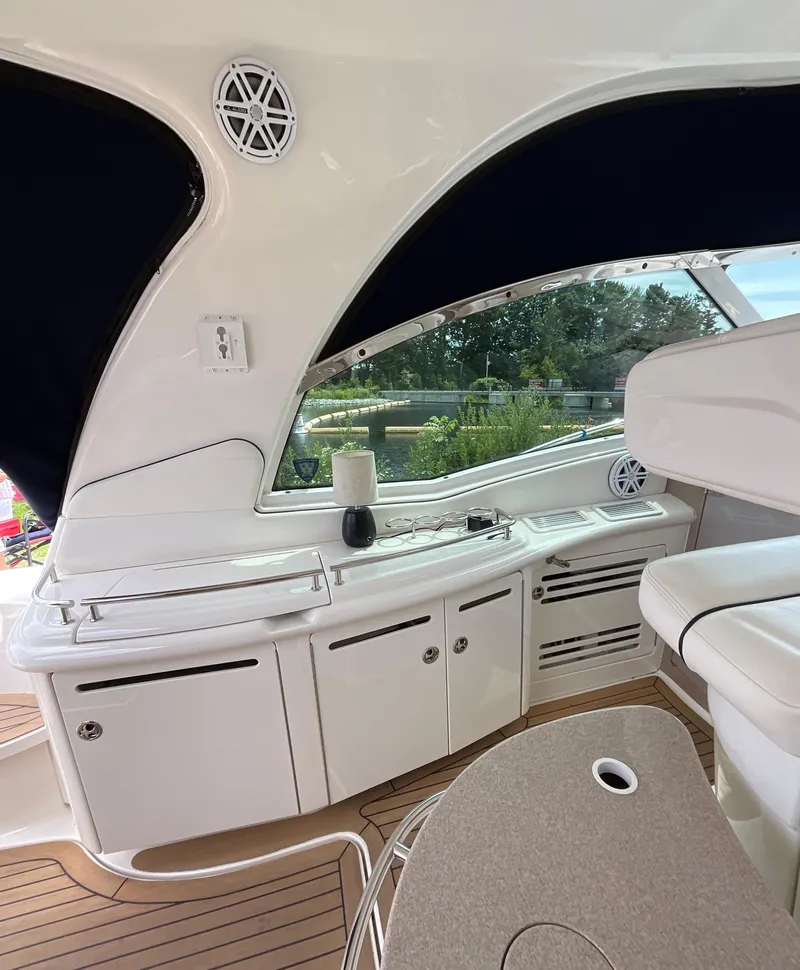 Slide: The Image of Luxurious interior of 2005 Sea Ray 500 Sundancer yacht with sleek white cabinetry. - 6