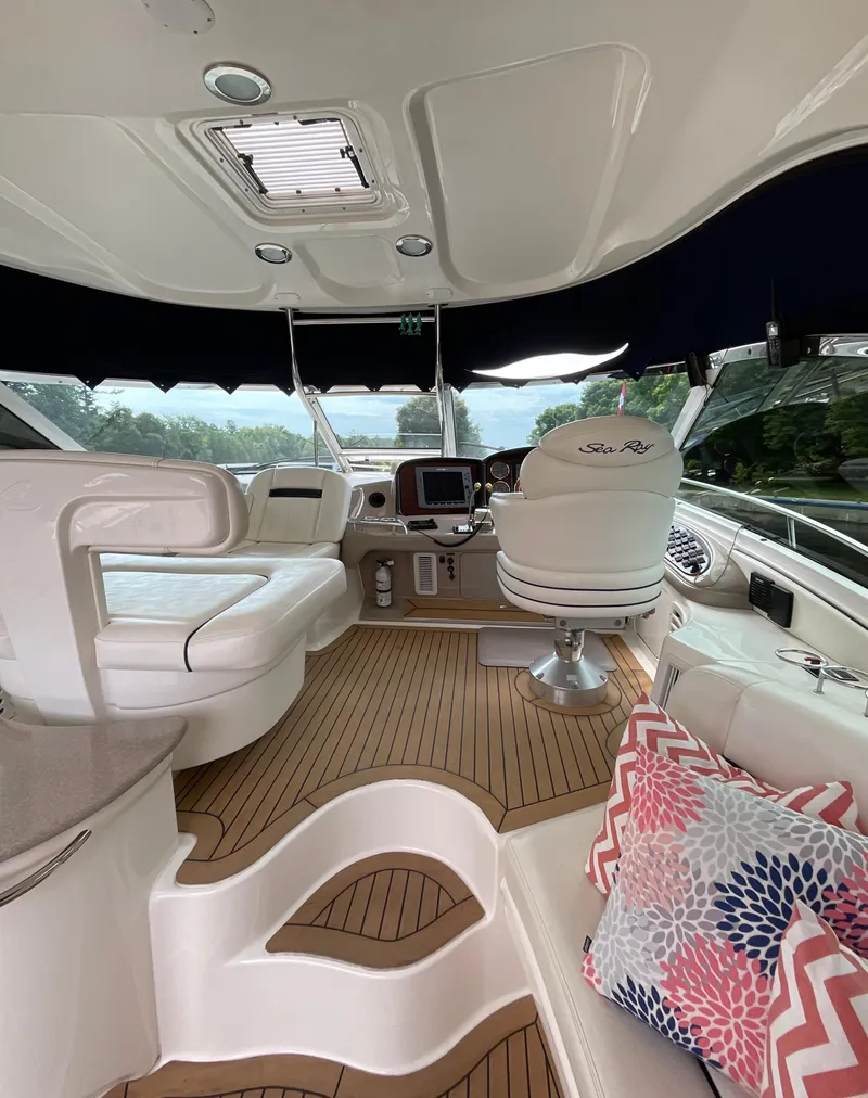 Slide: The Image of Luxurious 2005 Sea Ray 500 Sundancer yacht interior with plush seating and modern dashboard. - 7