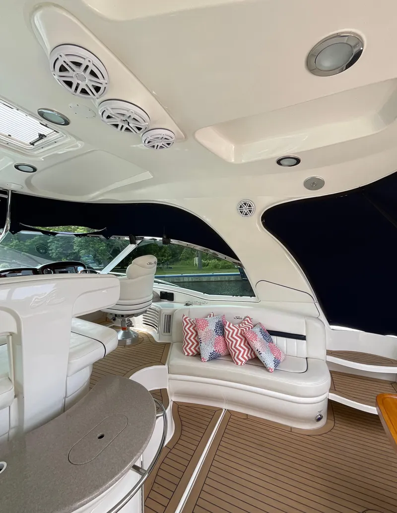Slide: The Image of Interior of 2005 Sea Ray 500 Sundancer yacht with seating and decorative pillows. - 8