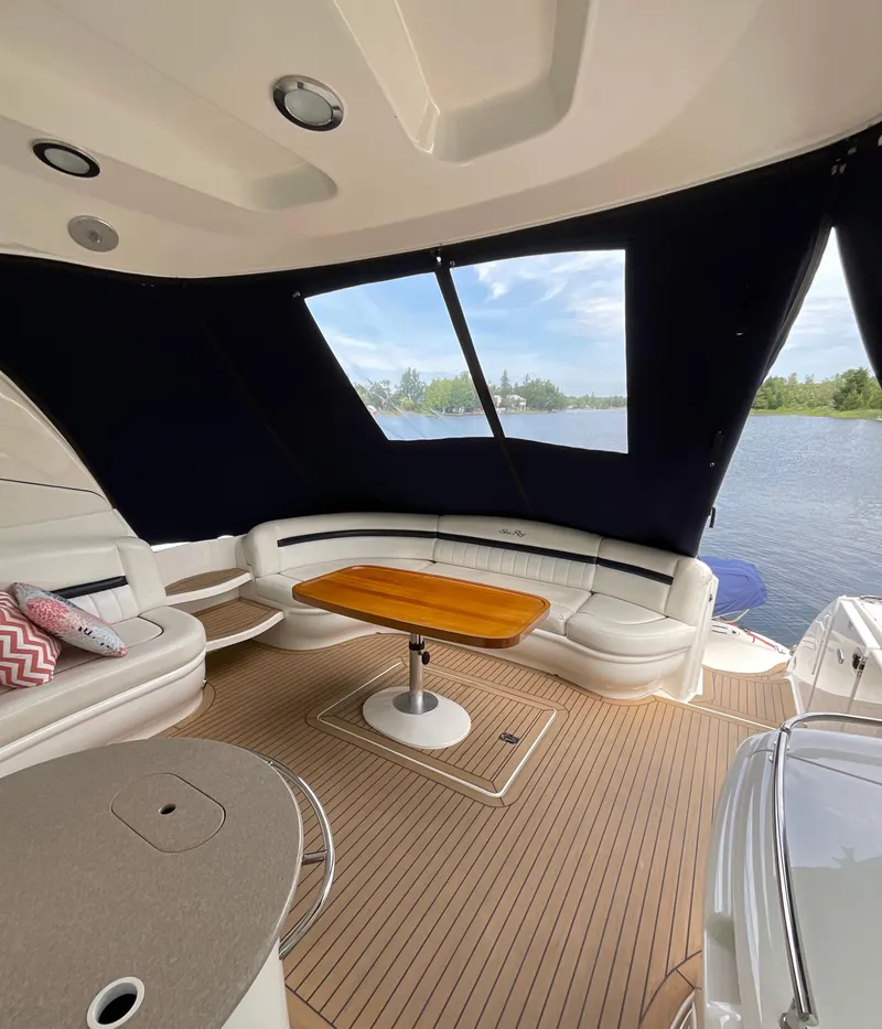 Slide: The Image of Luxurious interior of 2005 Sea Ray 500 Sundancer yacht with elegant seating and table. - 9