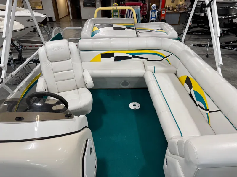 Slide: The Image of 2004 PlayCraft 2800 Powertoon interior with white seating and colorful accents. - 11