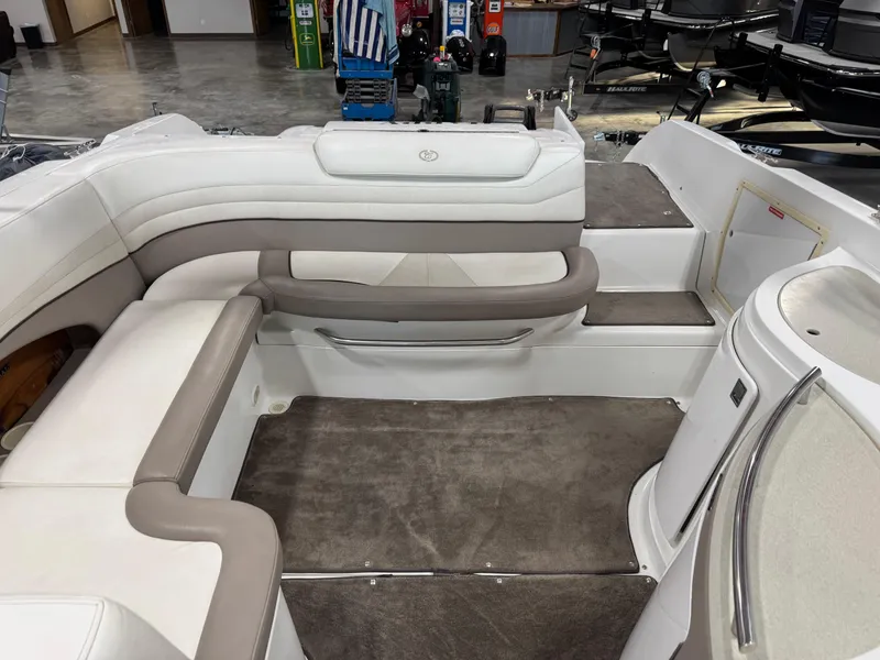 Slide: The Image of Interior of a 2000 Cobalt 292 boat with beige seating and carpeted flooring. - 7