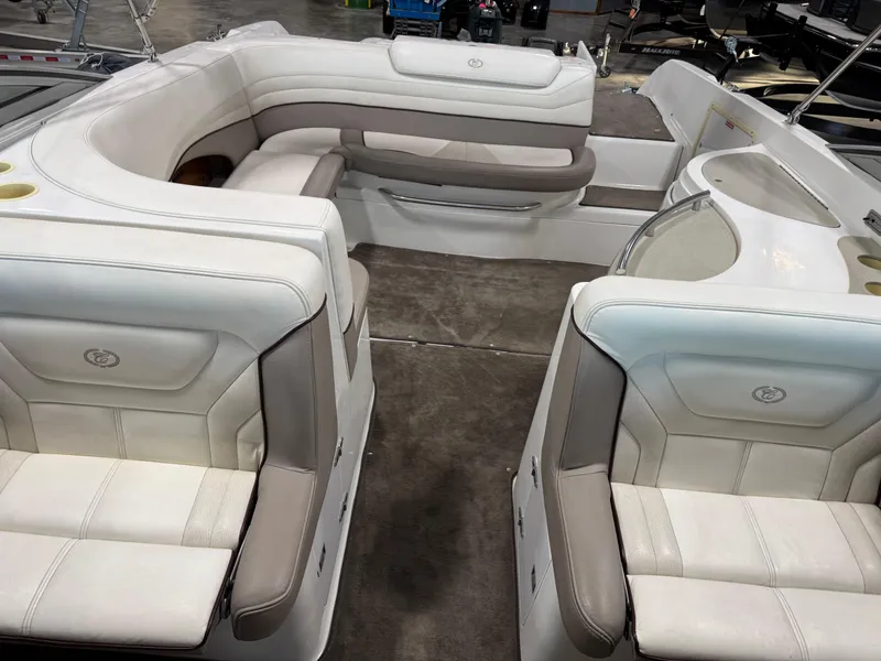 Slide: The Image of Interior of a 2000 Cobalt 292 boat with white and beige seating. - 8