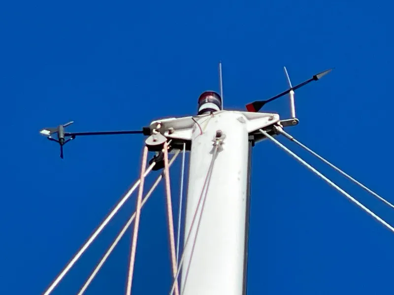 Slide: The Image of Mast top of 1964 CAL 40 sailboat against clear blue sky. - 18