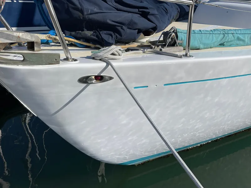 Slide: The Image of Close-up of a 1964 CAL 40 sailboat bow with ropes and nautical equipment. - 19