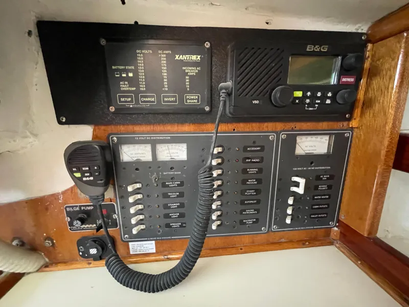 Slide: The Image of Electrical control panel on a 1964 CAL 40 sailboat, featuring various switches and gauges. - 8