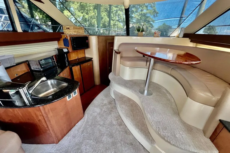 Slide: The Image of 2008 Meridian 391 Sedan interior with kitchenette and curved seating area. - 15