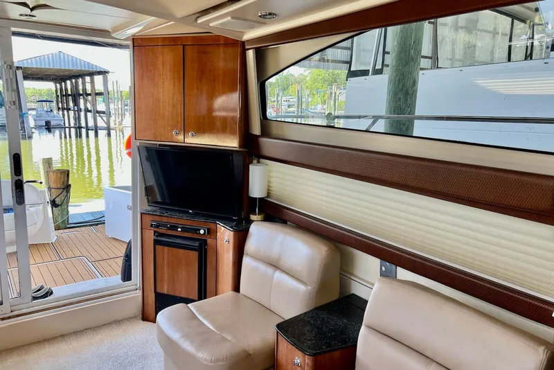 Slide: The Image of Interior of 2008 Meridian 391 Sedan yacht with leather seating and wood cabinetry. - 16